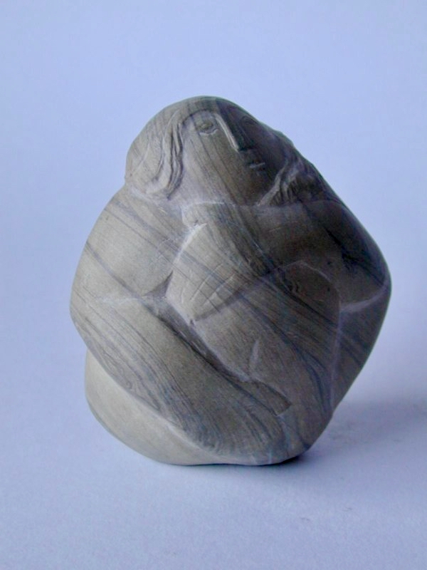 Seated figure — grey marble