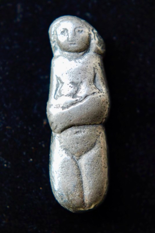 Small standing figure — silver