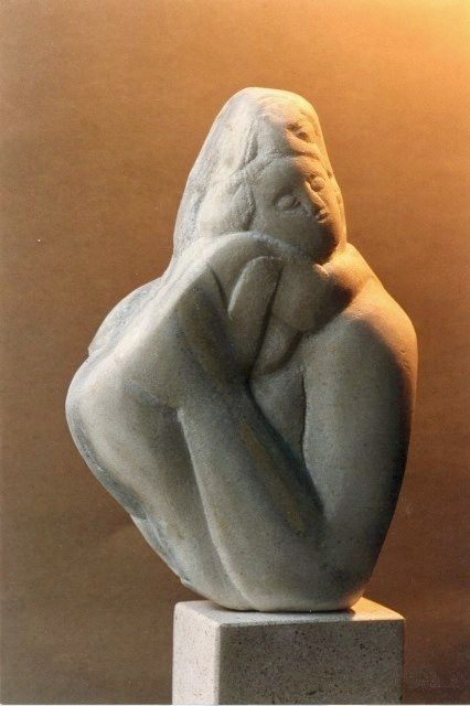 Seated figure — blue stone